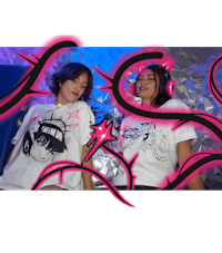 two girls wearing t - shirts with graffiti on them